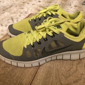 Neon yellow and gray athletic shoes.
